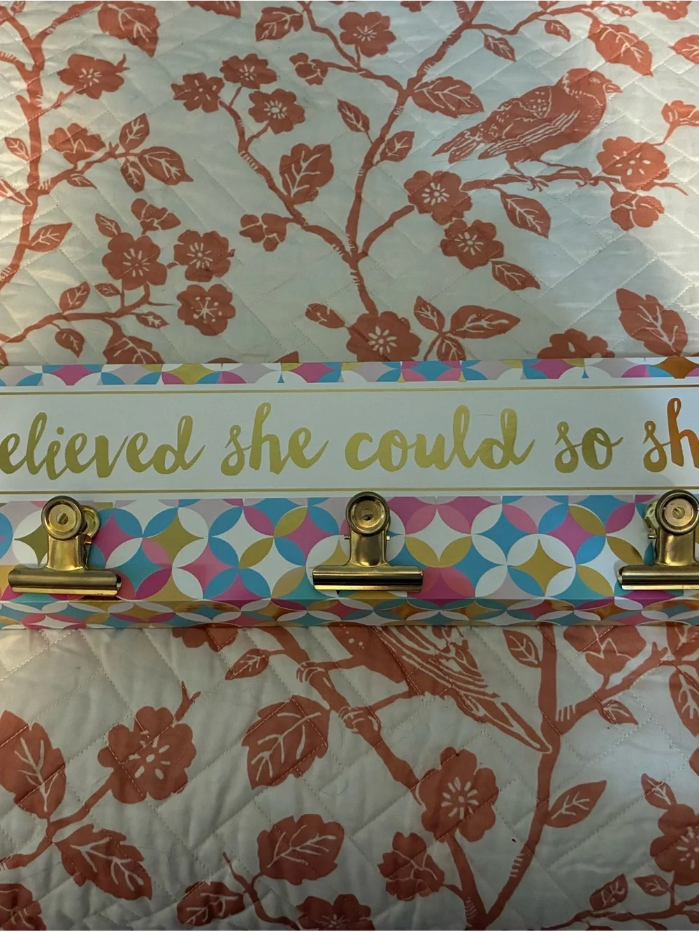 Gold Clip Wall Hook hanging with Pink, Blue & Yellow Pattern